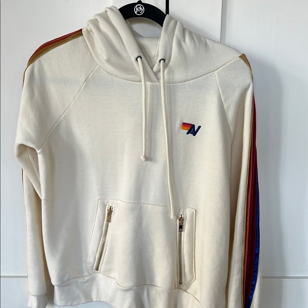 Aviator Nation Cream Hoodie with Red, Orange, Yellow, Blue Stripe Details